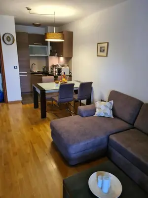 a living room with a couch and a table at Seaview Apartment in Bar