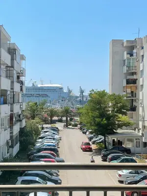 a view of a parking lot with cars parked at Seaview Apartment in Bar