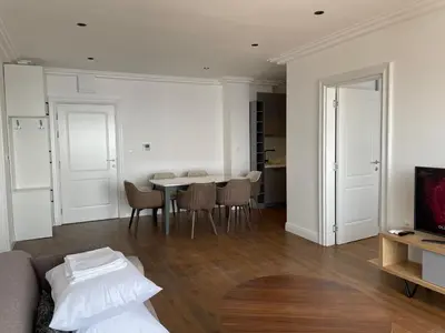a living room with a couch and a table at Lux Apartment Kamenovo in Sveti Stefan