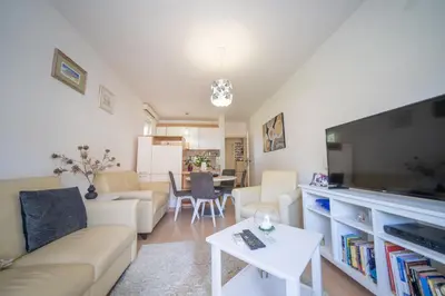 a living room with a large flat screen tv at Sunshine in Kotor