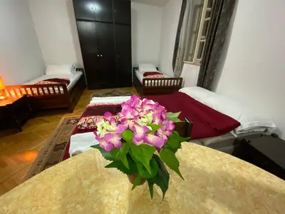 a room with a vase of flowers on a table at VivaV in Budva