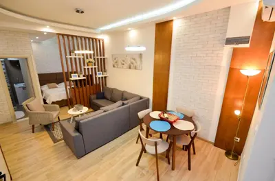 a living room with a couch and a table at Djardin in Kotor