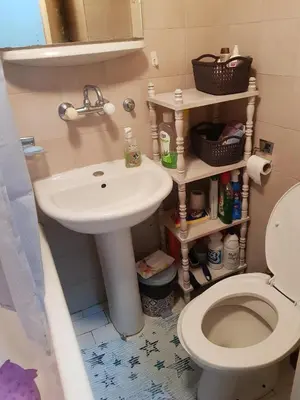 a bathroom with a white sink and a toilet at Apartman na najboljoj lokaciji , nedaleko od plaže in Bar
