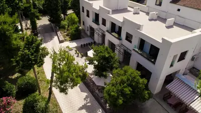 an overhead view of a white building at Zia Apartments in Bar