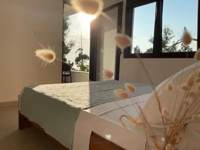 a bedroom with a bed and a window at Zia Apartments in Bar