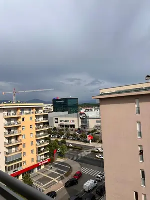 a view of a city with a parking lot and buildings at Apartman Natalia in Podgorica