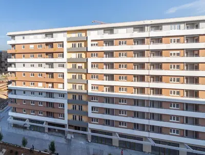 a large white apartment building with many windows at Consulate in Podgorica