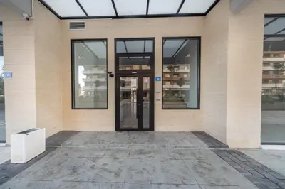 an empty building with a revolving door at Consulate in Podgorica