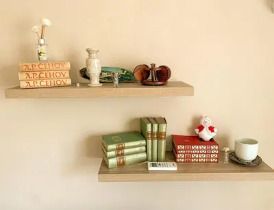 a bunch of books sitting on a shelf at Cute, spacious apt in the heart of the old town in Podgorica