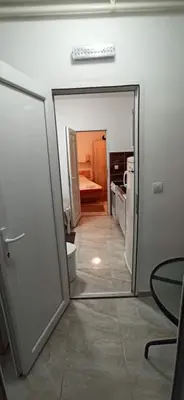 a room with a door and a mirror in a room at Java apartments - S & J in Dobrota