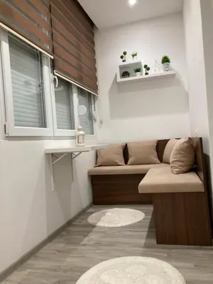 a small room with a couch and a window at Stan na dan Bogdan in Podgorica