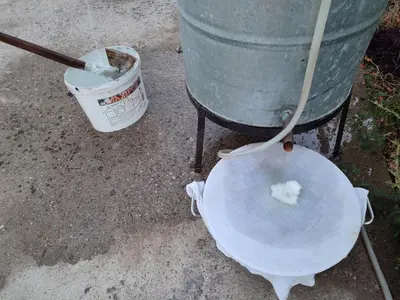 a bucket and a plate with a piece of food on it at SKADAr LAKE SARA 3 DM in Cetinje