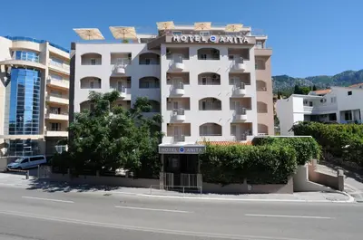 a building with a hotel on the side of it at Hotel Anita in Budva