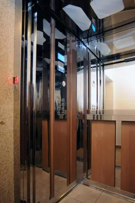 a glass revolving door in a building at Hotel Anita in Budva