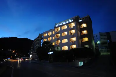 a building with lights on top of it at night at Hotel Anita in Budva