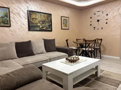 a living room with a couch and a table at Max Apartments in Podgorica