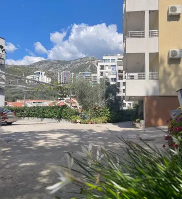 an empty parking lot in a city with buildings at Belveder Alevtina in Rafailovici