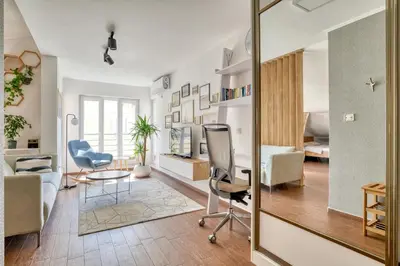 an office with a desk and chairs in a room at Cozy rooftop apartment with the city view in Budva