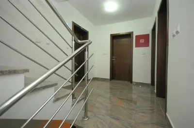 a hallway with a staircase and a door at Apartments Anita in Budva