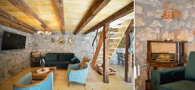 a living room with a wooden ceiling and a staircase at Rustic house Pojata in Njeguši