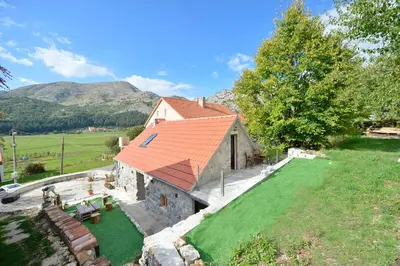 an aerial view of a house with an orange roof at Rustic house Pojata in Njeguši
