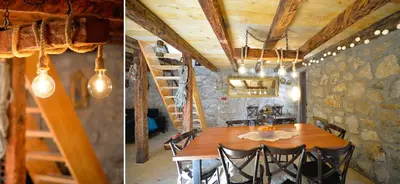 a dining room with a wooden table and a staircase at Rustic house Pojata in Njeguši