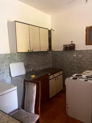 a kitchen with a sink and a stove top oven at Sunny Villa Apartments in Budva