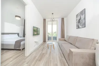 a living room with a couch and a bed at Skyline Vista in Becici