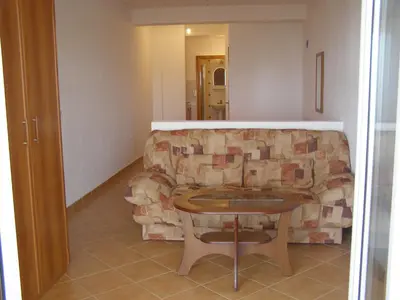a living room with a couch and a table at Apartments Kepi Gjerana in Ulcinj
