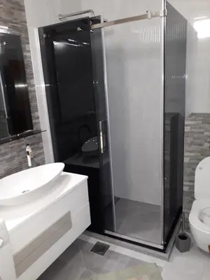 a bathroom with a shower and a sink and a toilet at Belvedere Apartments in Budva