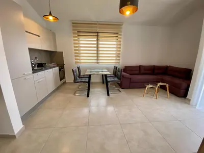 a living room with a couch and a table at Villa Dolphin Apartments in Petrovac na Moru