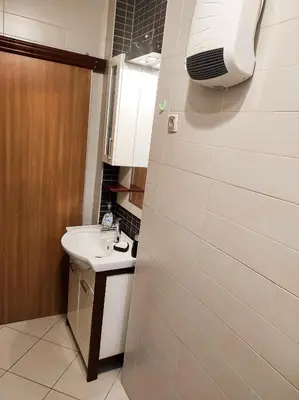 a bathroom with a sink and a mirror at Center 1 Podgorica in Podgorica