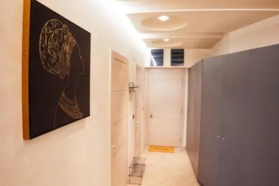 a hallway with a painting on the wall at Luxury Apartment Budva in Budva