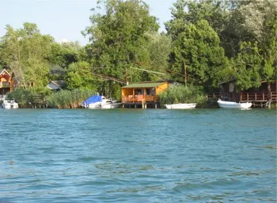a group of houses on the banks of a river at Artemis Apartment in Ulcinj