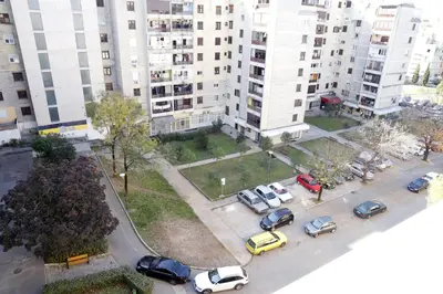 an aerial view of a parking lot in a city at Apartment Alexandar in Podgorica