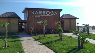 a building with a sign that reads barossa restaurant at House Munich - Montenegro in Donji Štoj