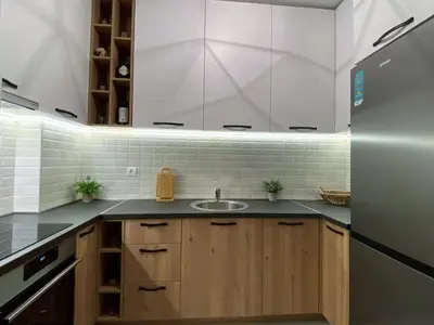 a kitchen with a sink and a refrigerator at MonteRelax Apartments Becici in Rafailovici
