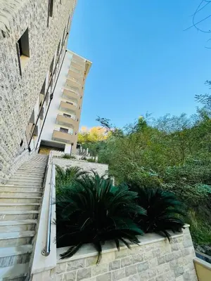 a set of stairs leading up to a building at MonteRelax Apartments Becici in Rafailovici