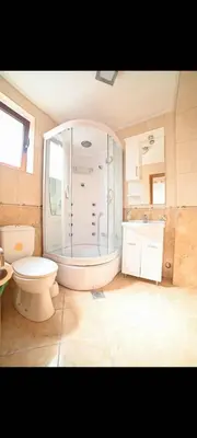 a bathroom with a shower and a toilet in it at Villa M in Dobra Voda