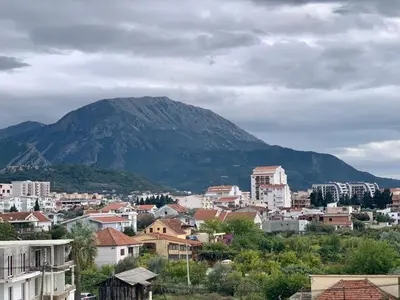 a view of a city with a mountain in the background at Corall apartment Bar in Bar