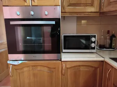 a microwave oven sitting on top of a kitchen counter at Apartmani Tomić 4* in Rafailovici