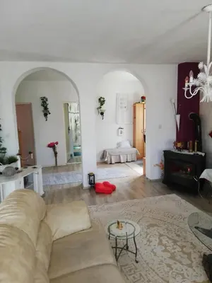 a living room with a couch and a table at Prima House in Podgorica