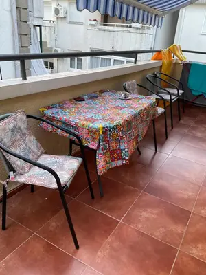 a table and chairs sitting on a balcony at Apartman Luka Budva in Budva
