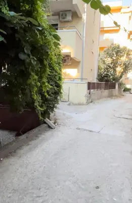 an empty street in front of a building at Apartman Luka Budva in Budva