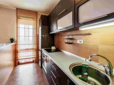 a kitchen with a sink and a counter top at Sunny three-bedroom apartment in Budva in Budva