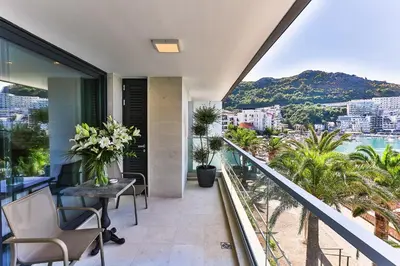 an apartment balcony with a view of the ocean at Sunraf Luxe Apartments in Budva