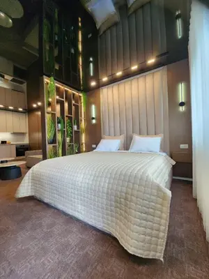 a bedroom with a large white bed in a room at Harmony Apartments in Podgorica