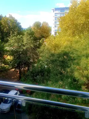 a view of a street with trees and a building at LUX Apartment - Central Place Bar in Bar