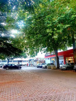 a group of cars parked in a parking lot at LUX Apartment - Central Place Bar in Bar