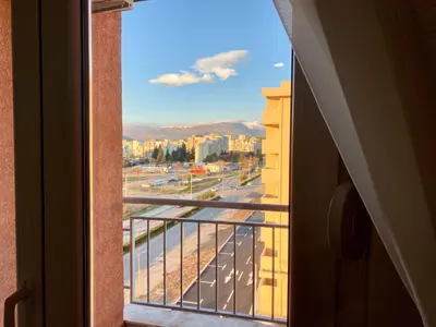 a view of a city from an open window at RIO 1 in Podgorica